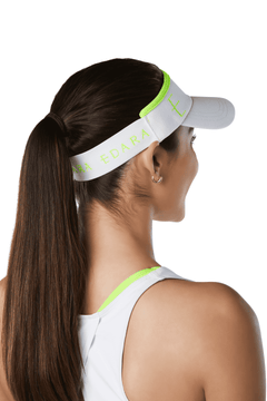 White tennis visor with neon yellow accents.