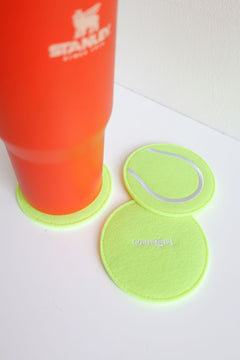 Neon yellow and white embroidered felt tennis ball coasters that are perfect for a hostess gift or kind gesture to your tennis loving friends.