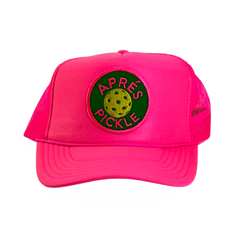 A neon pink foam trucker hat with a custom "Apres Pickle" patch for all pickleball enthusiasts.